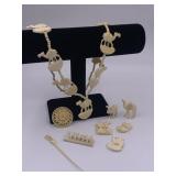 Assortment of bone pins, pendants, picks and jewel