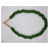Strand of bright green sand cast beads