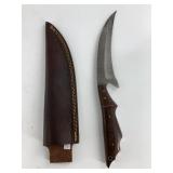 Damascus bladed hawkbill knife with a Philipino ha