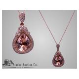14 karat gold morganite and diamond pendant. One p 14 karat gold morganite and diamond pendant. One p