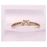 14kt gold and diamond engagement ring with a singl 14kt gold and diamond engagement ring with a singl