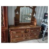 Vintage wood dresser with a large vanity mirror an