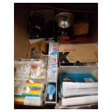 Box full of vintage and antique camera parts, bulb