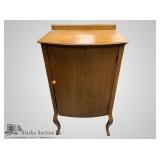 Antique oak cabinet with graceful curved legs, in
