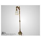 Gold toned floor lamp with vintage glass shade