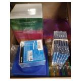 Box full of DVD cases and Sony Handicam DVDS NO SH