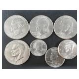 Four Eisenhower dollars, 2 non silver Kennedy half
