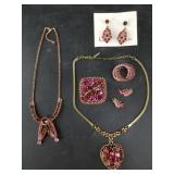 Selection of pink, red and purple rhinestone jewel