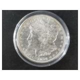 Morgan silver dollar, 1904 O AU 55 or better