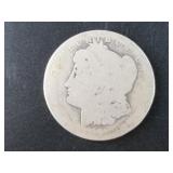 Morgan silver dollar, 1881 O? grades around a VG 8