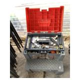 Tool box with some tools and accessories and a foo