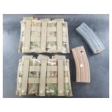 Eight 30 rounds steel M4 magazines and 2 three slo