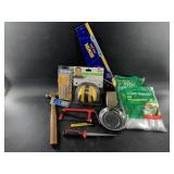 Assorted construction tools, vinyl door seal, etc.
