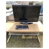 Lot with a heavy duty vintage metal table and a fl