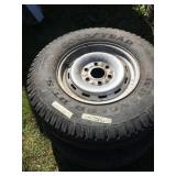 Lot with 2 tires on chevy 6 lugs wheels size 245/7