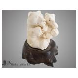 Michael Scott in the round carving of a mother bea