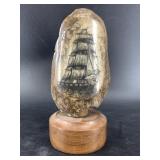 Michael Scott scrimmed sailing vessel on a dark an