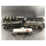 Collection of model train cars and locomotives