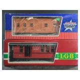 2 Large metal train cars, new in box, 1 is by USA