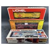 Two new in box Lionel train cars and a Rail King m