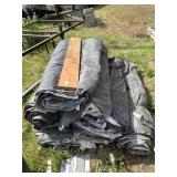 Several rolled up tarp covers