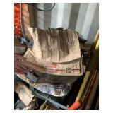 Lot with a commercial waste bin, and brackets