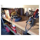 Shelf lot with a variety of power tools and fasten