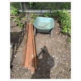 Wheelbarrow with several timbers