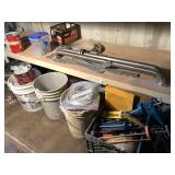 Lot with 2 bathroom shower rails, several buckets