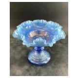 Blue carnival glass flared bowl, maybe a candy dis