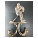 Cast iron hockey player wall hook. It is brand new