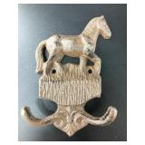 Cast iron horse shaped double wall hook. Brand new