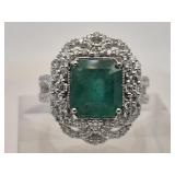 Natural emerald and diamond platinum ring, center