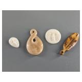Variety of fossilized ivory pendants and platchets