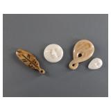 Variety of fossilized ivory pendants and platchets