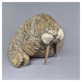 Soapstone carving of walrus with mammoth ivory tus