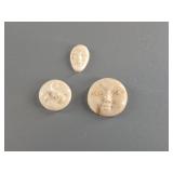 3 Fossilized ivory faces largest is 3/4"