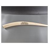 Scrimshawed female walrus tusk depicting group of