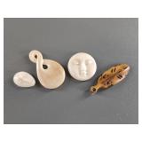 Variety of fossilized ivory pendants and platchets