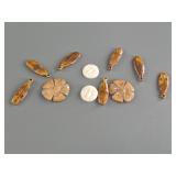 Variety of fossilized ivory pendants and platchets