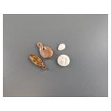 Variety of fossilized ivory pendants and platchets