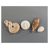 Variety of fossilized ivory pendants and platchets