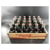 24 Pack of vintage glass Coke bottles in wood crat