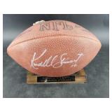 Football signed by Kordell Stewart on a display st
