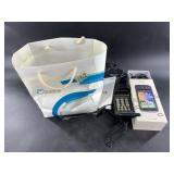 Motorola 1990s cell phone with accessories
