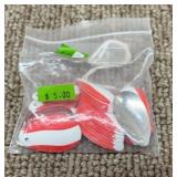 Lot of sm red  and white spoons