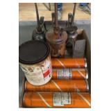 Tubes of Greece and oil cans