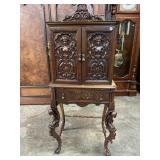 WALNUT HEAVY CARVED CHERUB FOAM CABINET
