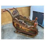 LARGE CARVED AND DECORATED SLEIGH
