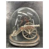 POLISHED STAINLESS STEEL LARGE CANNON IN GLASS